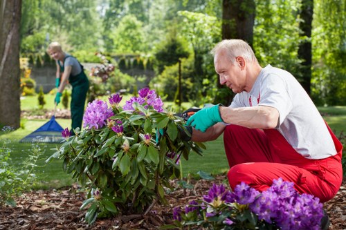 Volunteers receiving donated mulch and woody material from a local gardening charity